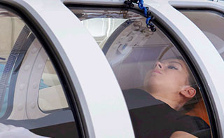A person in a hyperbaric chamber
